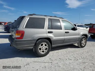 2001 Jeep Grand Cherokee Laredo with VIN 1J4GW48N01C682814, listed as a Copart auction lot 76239634 with 0 mi miles and Salvage Title. Bid and sale history available at carsss.com. Image 3.