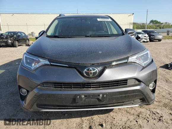 2018 Toyota RAV4 XLE with VIN 2T3WFREV0JW517488, listed as a Copart auction lot 51000975 with 68,105 mi miles and Salvage title. Bid and sale history available at DreamBid. Image 5.