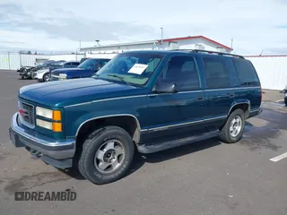 1999 GMC Yukon with VIN 1GKEK13R3XJ717999, listed as a IAAI auction lot 41870187 with 179,855 mi miles. Bid and sale history available at carsss.com. Image 18.