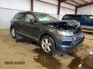 2014 Volkswagen Touareg Lux z VIN WVGEF9BP9ED014963, wystawiony jako Copart lot #50555345 z przebiegiem 153 907 mil mil oraz Szkoda całkowita • Salvage title. Historia ofert i sprzedaży dostępna na DreamBid. Obrazek 4.
