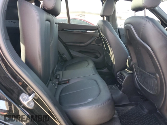 2016 BMW X1 xDrive28i z VIN WBXHT3C35G5E50005, wystawiony jako Copart lot #74476533 z przebiegiem 128 031 mil mil oraz Szkoda całkowita • Salvage title. Historia ofert i sprzedaży dostępna na DreamBid. Obrazek 11.