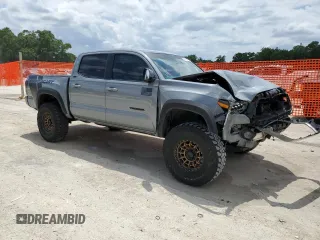 2020 Toyota Tacoma SR5 z VIN 3TMAZ5CN0LM115004, wystawiony jako Copart lot #55343295 z przebiegiem 82 865 mil mil oraz Nie do naprawy • Non repairable. Historia ofert i sprzedaży dostępna na DreamBid. Obrazek 4.