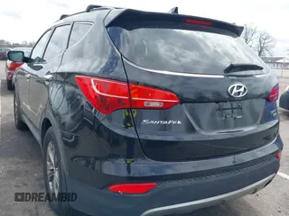 2014 Hyundai Santa Fe z VIN 5XYZUDLBXEG162476, wystawiony jako IAAI lot #41910671 z przebiegiem 146 607 mil mil oraz . Historia ofert i sprzedaży dostępna na DreamBid. Obrazek 3.