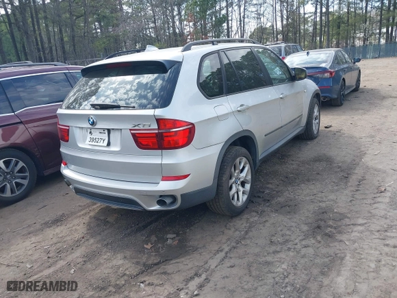 2011 BMW X5 35i with VIN 5UXZV4C53BL403476, listed as a IAAI auction lot 41820844 with 104,472 mi miles. Bid and sale history available at carsss.com. Image 4.
