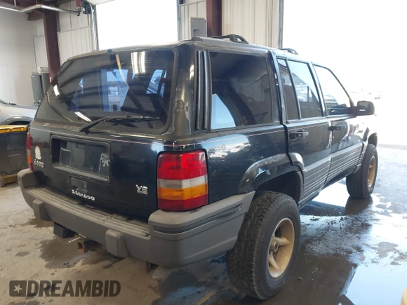 1995 Jeep Grand Cherokee Laredo z VIN 1J4GZ58Y3SC670696, wystawiony jako IAAI lot #42530934 z przebiegiem 165 658 mil mil oraz . Historia ofert i sprzedaży dostępna na DreamBid. Obrazek 4.