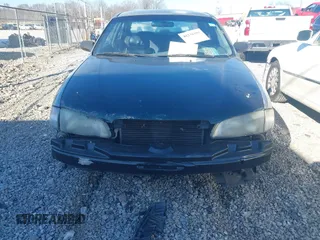 1999 Mazda 626 LX with VIN 1YVGF22DXX5847298, listed as a IAAI auction lot 41236165 with 194,445 mi miles. Bid and sale history available at carsss.com. Image 6.