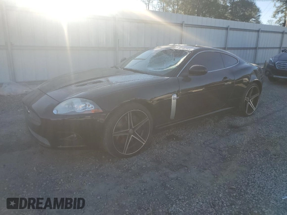 2007 Jaguar XK with VIN SAJWA43C779B19601, listed as a Copart auction lot 80102504 with 78,313 mi miles and Salvage Title. Bid and sale history available at carsss.com. Image 1.