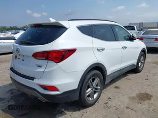 2018 Hyundai Santa Fe 2.4L z VIN 5NMZUDLB3JH055771, wystawiony jako IAAI lot #42126058 z przebiegiem 142 991 mil mil oraz . Historia ofert i sprzedaży dostępna na DreamBid. Obrazek 4.