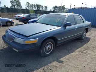 1996 Mercury Grand Marquis GS with VIN 2MELM74W8TX697141, listed as a IAAI auction lot 42082750 with 138,963 mi miles and . Bid and sale history available at DreamBid. Image 2.