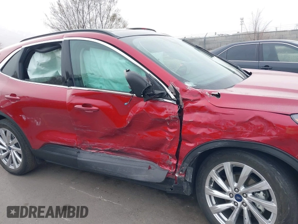 2021 Ford Escape Titanium Hybrid with VIN 1FMCU9DZ1MUA01599, listed as a IAAI auction lot 41912441 with 20,660 mi miles and . Bid and sale history available at DreamBid. Image 6.