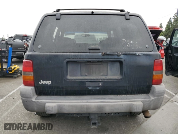 1998 Jeep Grand Cherokee Laredo with VIN 1J4FX58S0WC305329, listed as a Copart auction lot 76777264 with 251,942 mi miles and Clean Title. Bid and sale history available at carsss.com. Image 6.