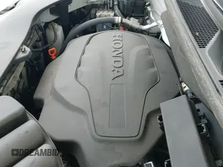 2022 Honda Pilot Touring 7-Passenger z VIN 5FNYF5H66NB034248, wystawiony jako IAAI lot #41777362 z przebiegiem 26 611 mil mil oraz . Historia ofert i sprzedaży dostępna na DreamBid. Obrazek 19.