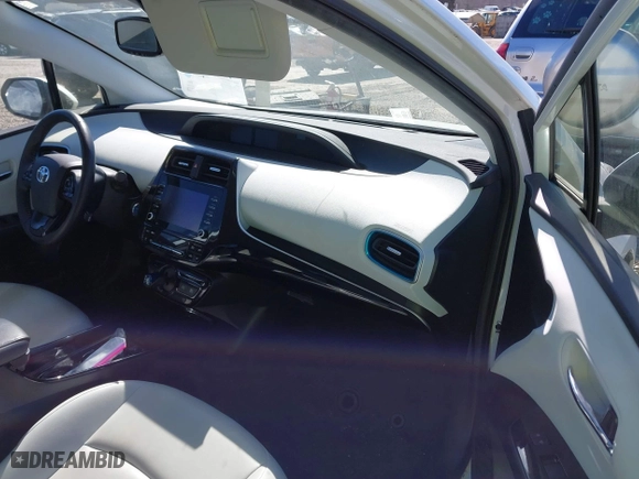 2021 Toyota Prius L Eco with VIN JTDKAMFUXM3142402, listed as a IAAI auction lot 41665484 with 67,416 mi miles. Bid and sale history available at carsss.com. Image 5.