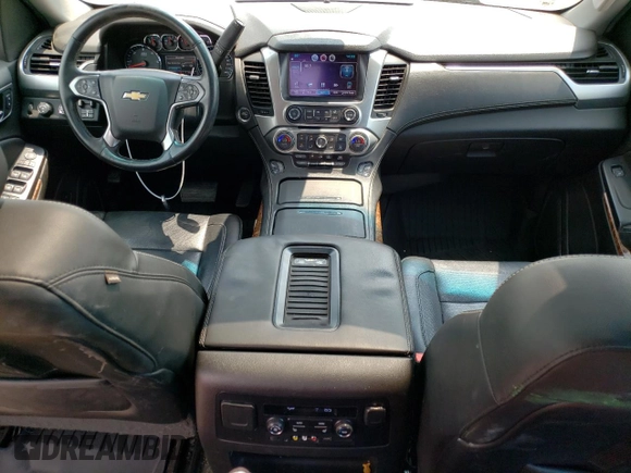 2015 Chevrolet Suburban LTZ with VIN 1GNSKKKC6FR556105, listed as a Copart auction lot 64034304 with 106,269 mi miles and Salvage Title. Bid and sale history available at DreamBid. Image 8.