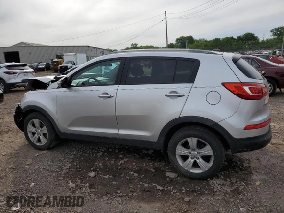 2012 Kia Sportage LX z VIN KNDPB3A29C7264856, wystawiony jako Copart lot #58397685 z przebiegiem 144 621 mil mil oraz Szkoda całkowita • Salvage title. Historia ofert i sprzedaży dostępna na DreamBid. Obrazek 2.