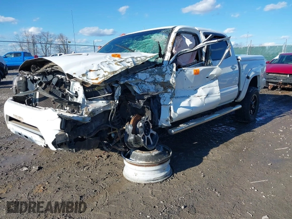 2015 Toyota Tacoma with VIN 3TMLU4EN8FM200529, listed as a IAAI auction lot 41602598 with 98,456 mi miles and . Bid and sale history available at DreamBid. Image 2.