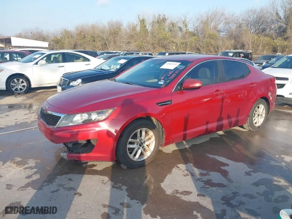 2011 Kia Optima LX with VIN KNAGM4A72B5072570, listed as a IAAI auction lot 41802542 with 188,922 mi miles. Bid and sale history available at carsss.com. Image 2.