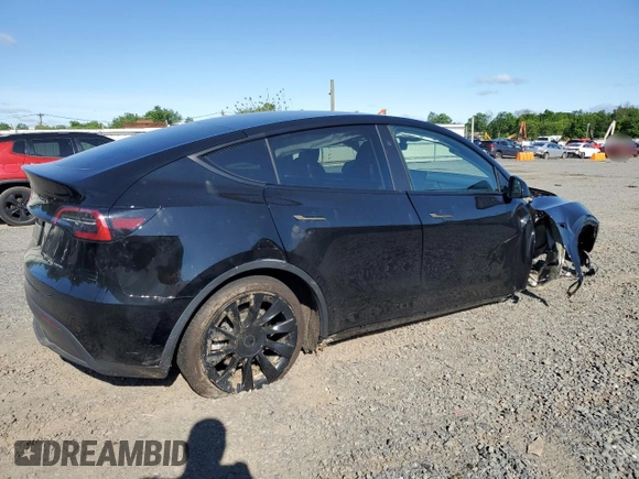 2023 Tesla Model Y Long Range z VIN 7SAYGDEE1PF865195, wystawiony jako Copart lot #57455765 z przebiegiem 32 011 mil mil oraz Szkoda całkowita • Salvage title. Historia ofert i sprzedaży dostępna na DreamBid. Obrazek 3.