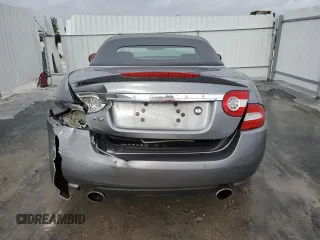 2010 Jaguar XK with VIN SAJWA4GB4ALB37114, listed as a Copart auction lot 77673824 with 99,999 mi miles and Salvage Title. Bid and sale history available at carsss.com. Image 6.