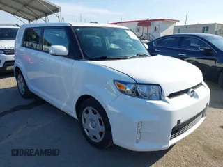 2014 Scion xB with VIN JTLZE4FE0EJ048932, listed as a IAAI auction lot 41992285 with 129,567 mi miles. Bid and sale history available at carsss.com. Image 1.
