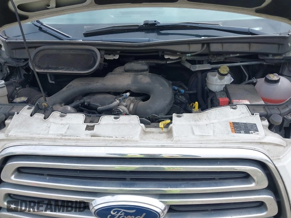 2015 Ford Transit Cargo with VIN 1FTNR1ZM6FKA34609, listed as a IAAI auction lot 42635875 with 214,750 mi miles and . Bid and sale history available at DreamBid. Image 10.