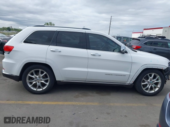 2014 Jeep Grand Cherokee Summit z VIN 1C4RJFJG2EC476114, wystawiony jako IAAI lot #42249108 z przebiegiem 97 569 mil mil oraz . Historia ofert i sprzedaży dostępna na DreamBid. Obrazek 14.