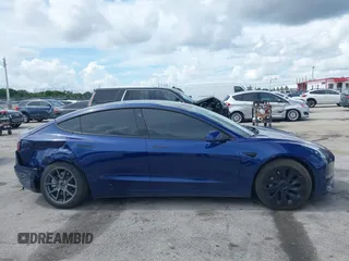 2022 Tesla Model 3 with VIN 5YJ3E1EA4NF191808, listed as a IAAI auction lot 39564406 with 6,756 mi miles. Bid and sale history available at carsss.com. Image 13.