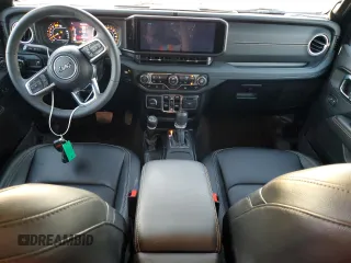 2024 Jeep Wrangler Sahara with VIN 1C4PJXENXRW118401, listed as a Copart auction lot 84731534 with 6,895 mi miles and Salvage Title. Bid and sale history available at DreamBid. Image 8.