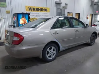 2004 Toyota Camry LE with VIN 4T1BE32K24U852256, listed as a IAAI auction lot 42036477 with 154,389 mi miles. Bid and sale history available at carsss.com. Image 4.