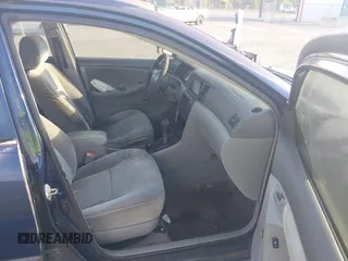2005 Toyota Corolla CE with VIN 1NXBR32E25Z563569, listed as a IAAI auction lot 42100384 with 243,610 mi miles and . Bid and sale history available at DreamBid. Image 5.