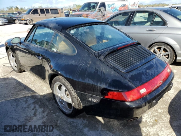 1995 Porsche 911 Carrera with VIN WP0AA2990SS323244, listed as a Copart auction lot 77215074 with 0 mi miles and Non Repairable. Bid and sale history available at carsss.com. Image 2.
