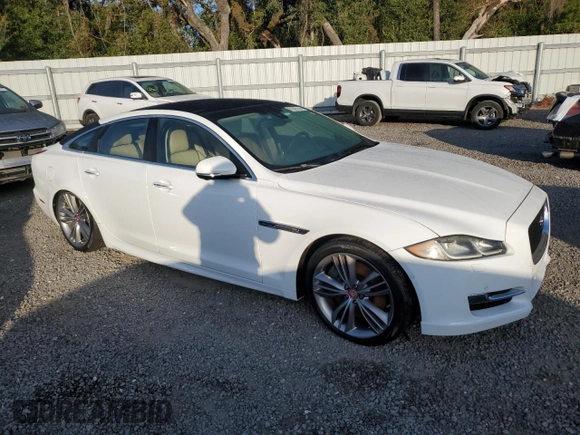 2016 Jaguar XJ with VIN SAJWA1CE4GMV91734, listed as a Copart auction lot 81005144 with 31,924 mi miles and Salvage Title. Bid and sale history available at DreamBid. Image 4.