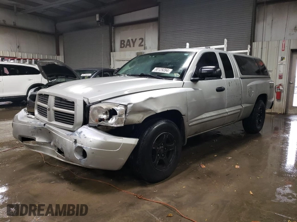 2006 Dodge Dakota SLT with VIN 1D7HW42NX6S711998, listed as a Copart auction lot 80129394 with 214,546 mi miles and Salvage Title. Bid and sale history available at carsss.com. Image 1.