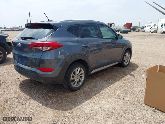 2017 Hyundai Tucson SE Plus with VIN KM8J33A42HU375273, listed as a IAAI auction lot 41900474 with 124,658 mi miles. Bid and sale history available at carsss.com. Image 4.