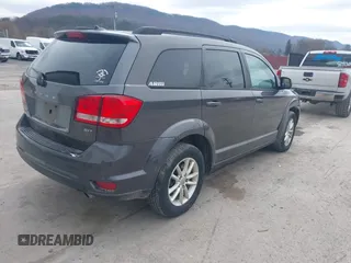 2014 Dodge Journey SXT z VIN 3C4PDDBG2ET161528, wystawiony jako IAAI lot #41932649 z przebiegiem 161 597 mil mil oraz . Historia ofert i sprzedaży dostępna na DreamBid. Obrazek 4.
