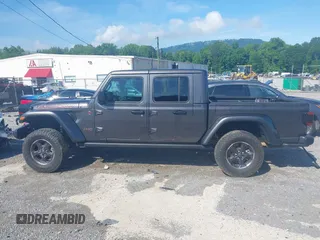 2021 Jeep Gladiator Rubicon z VIN 1C6JJTBG9ML592538, wystawiony jako IAAI lot #42206035 z przebiegiem 37 945 mil mil oraz . Historia ofert i sprzedaży dostępna na DreamBid. Obrazek 14.