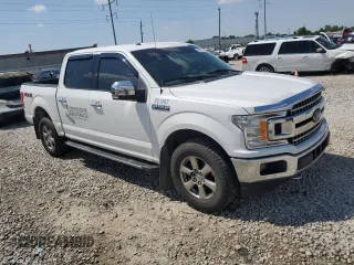2018 Ford F-150 XL with VIN 1FTEW1EP0JFA28850, listed as a Copart auction lot 63585615 with 210,626 mi miles and Salvage title. Bid and sale history available at DreamBid. Image 4.