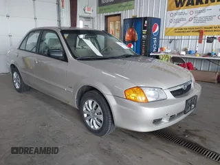 2000 Mazda Protege DX with VIN JM1BJ2221Y0239987, listed as a IAAI auction lot 42092488 with 140,756 mi miles and . Bid and sale history available at DreamBid. Image 1.