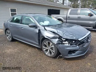 2021 Volkswagen Passat 2.0T SE with VIN 1VWSA7A3XMC011113, listed as a IAAI auction lot 41942881 with 63,753 mi miles. Bid and sale history available at carsss.com. Image 1.