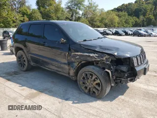 2018 Jeep Grand Cherokee Laredo E with VIN 1C4RJFAG9JC390597, listed as a Copart auction lot 71450474 with 69,645 mi miles and Salvage title. Bid and sale history available at DreamBid. Image 4.