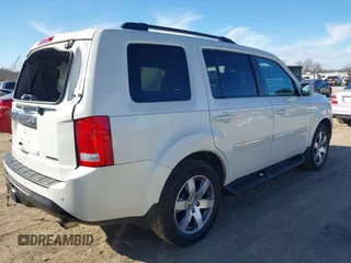 2015 Honda Pilot Touring with VIN 5FNYF3H97FB023842, listed as a IAAI auction lot 41673881 with 106,110 mi miles. Bid and sale history available at carsss.com. Image 4.