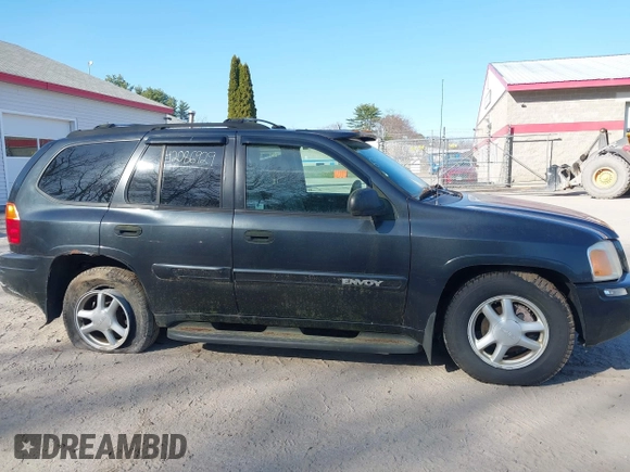 2005 GMC Envoy SLE z VIN 1GKDT13S852116252, wystawiony jako IAAI lot #42086929 z przebiegiem Nie podano mil oraz . Historia ofert i sprzedaży dostępna na DreamBid. Obrazek 14.