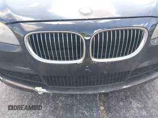 2012 BMW 7 Series 740i z VIN WBAKA4C50CDS99293, wystawiony jako IAAI lot #42208510 z przebiegiem 127 631 mil mil oraz . Historia ofert i sprzedaży dostępna na DreamBid. Obrazek 14.