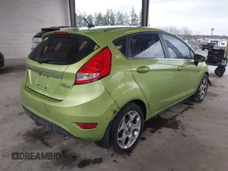 2011 Ford Fiesta SES with VIN 3FADP4FJ7BM127600, listed as a IAAI auction lot 41657170 with 135,483 mi miles. Bid and sale history available at carsss.com. Image 4.