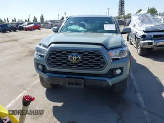 2022 Toyota Tacoma SR with VIN 3TMCZ5AN0NM489420, listed as a IAAI auction lot 42597175 with 129,340 mi miles and . Bid and sale history available at DreamBid. Image 13.