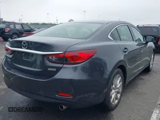 2014 Mazda 6 i Sport with VIN JM1GJ1U52E1102800, listed as a IAAI auction lot 42266283 with 103,886 mi miles and . Bid and sale history available at DreamBid. Image 4.