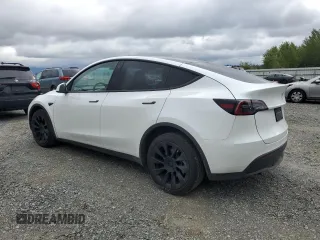 2023 Tesla Model Y Long Range z VIN 7SAYGDEE3PF751019, wystawiony jako Copart lot #57972885 z przebiegiem 24 591 mil mil oraz Szkoda całkowita • Salvage title. Historia ofert i sprzedaży dostępna na DreamBid. Obrazek 2.