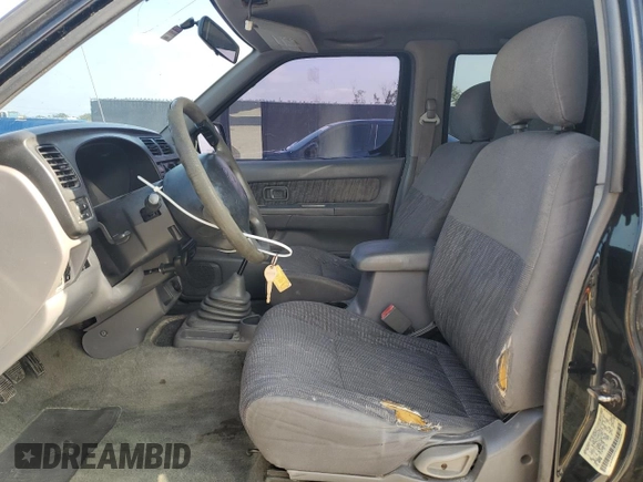 2000 Nissan Frontier XE with VIN 1N6ED27T7YC300373, listed as a Copart auction lot 55829535 with 301,305 mi miles and Salvage title. Bid and sale history available at DreamBid. Image 7.
