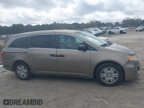 2012 Honda Odyssey LX z VIN 5FNRL5H25CB019912, wystawiony jako IAAI lot #41458224 z przebiegiem 158 980 mil mil oraz . Historia ofert i sprzedaży dostępna na DreamBid. Obrazek 14.