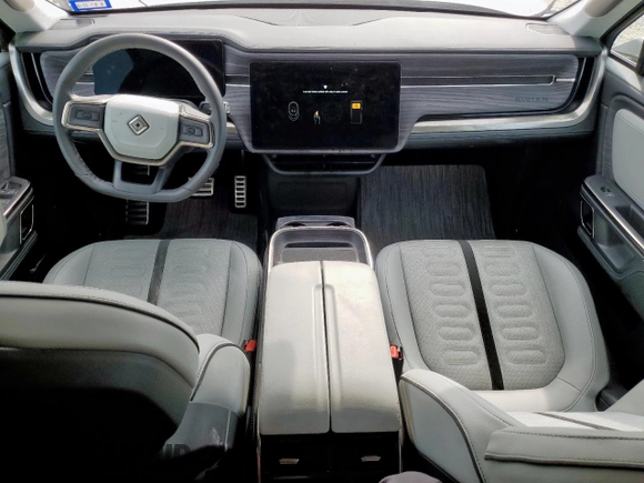 2023 Rivian R1S Adventure z VIN 7PDSGABA4PN026056, wystawiony jako Copart lot #56892495 z przebiegiem Nie podano mil oraz Szkoda całkowita • Salvage title. Historia ofert i sprzedaży dostępna na DreamBid. Obrazek 8.